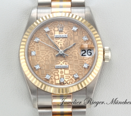 Uhransicht von vorne, hauptsächlich das Zifferblatt und die Lünette sichtbar. Rolex Medium Datejust Tridor Weissgold Rosegold Gelbgold 750 Diamanten Automatik Gold