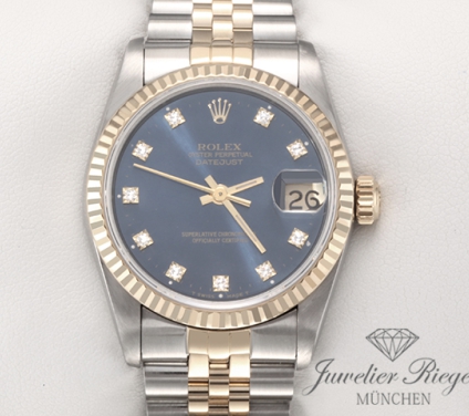 Uhransicht von vorne, hauptsächlich das Zifferblatt und die Lünette sichtbar. Rolex Medium Datejust Stahl Gelbgold 750 Diamanten Automatik Gold Stahl Damen