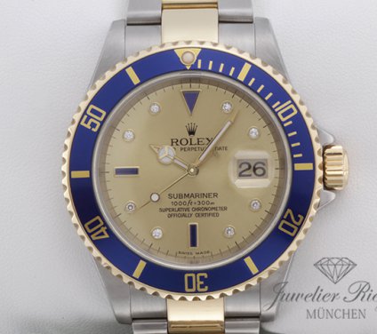 Uhransicht von vorne, hauptsächlich das Zifferblatt und die Lünette sichtbar. Rolex Submariner 16613 T Sultan 2010 Stahl Gelbgold 750 Automatik Gold
